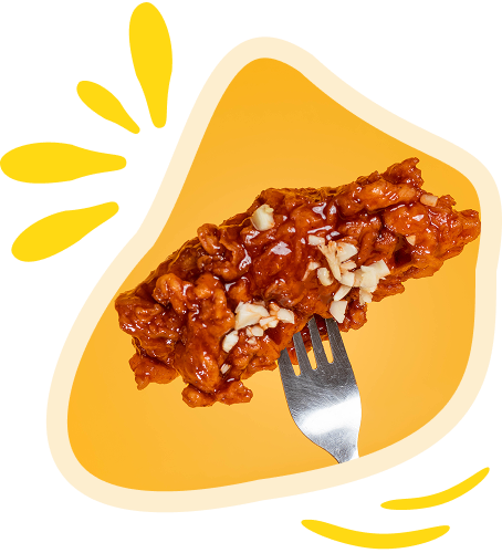 Hand holding fried chicken